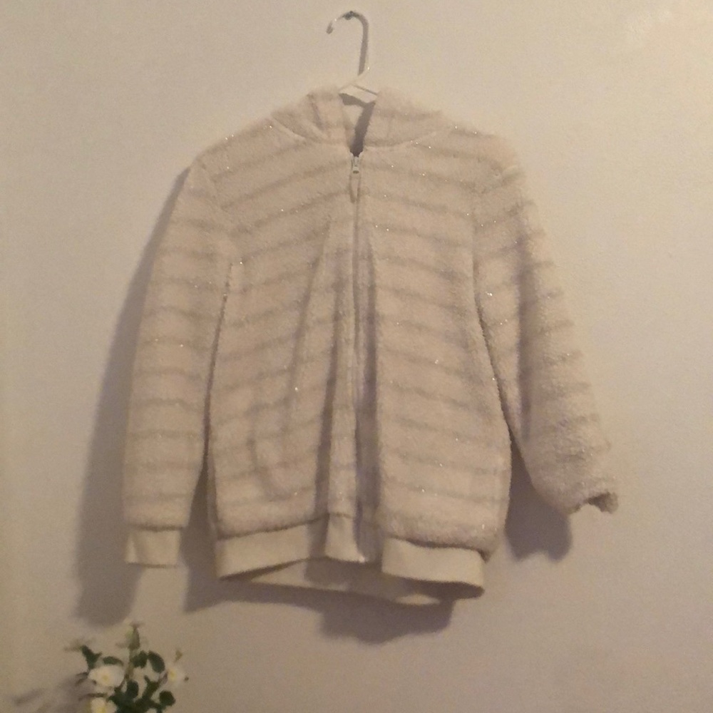 This sweater is fluffy, not only but also it’s sparkly with ears on the hoodie.